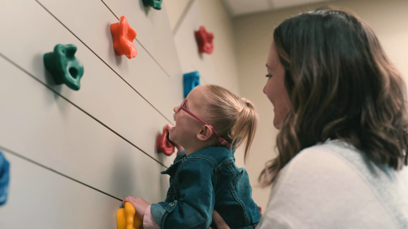 Photo of pediatric client and team member